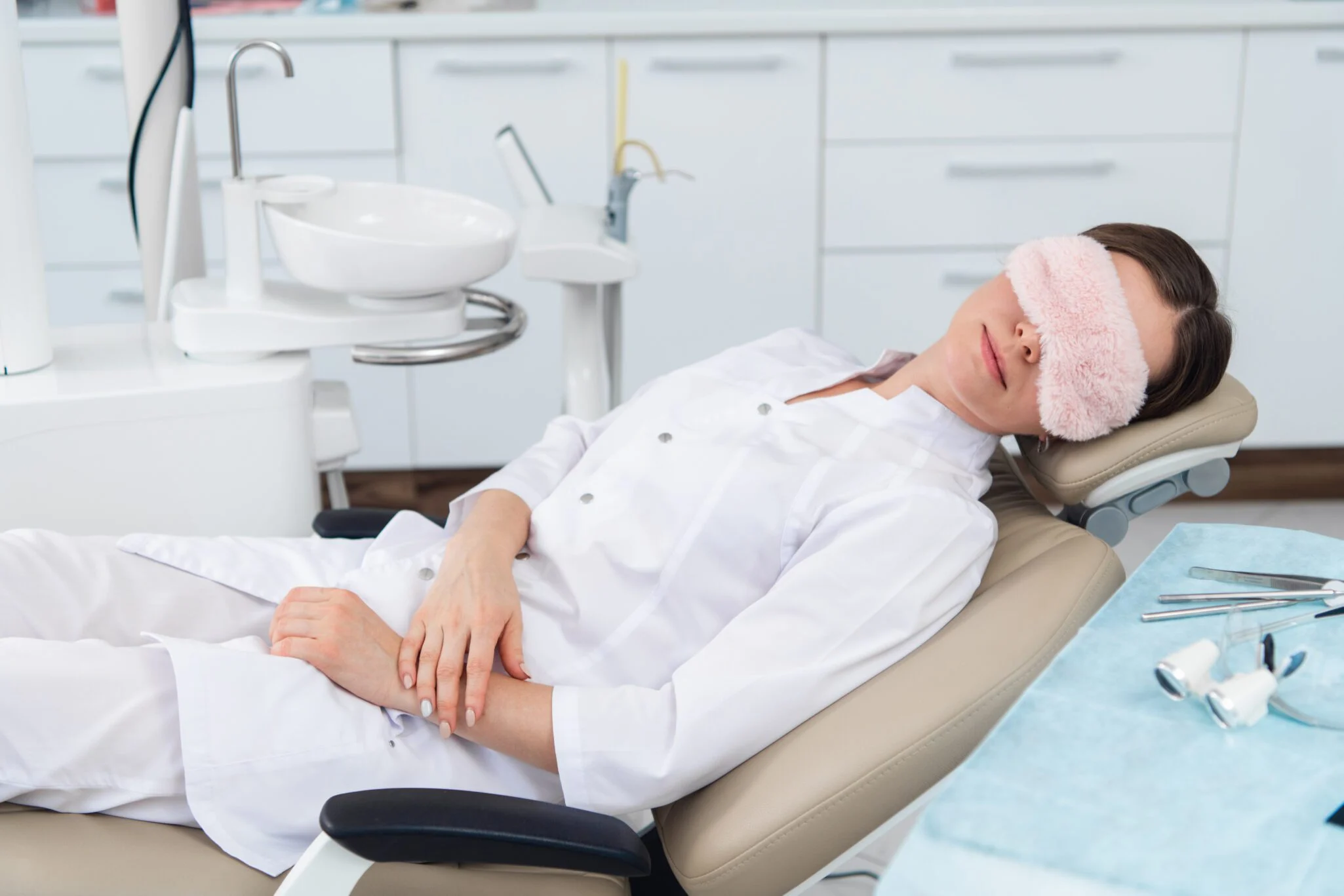 Comfort menu with wireless headphones and amenities at MDRN Dental Studio